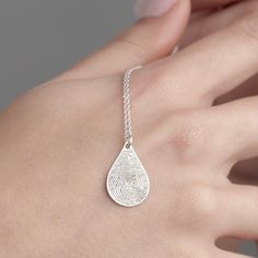 "Tear Drop Fingerprint Necklace, Engraved Fingerprint Jewelry in Sterling Silver is made by hand in our workshop with care. All our jewelry is the most elegant choice for the Bridesmaids, friends, your loved ones and for yourself. Tear Drop Fingerprint Necklace, Engraved Fingerprint Jewelry in Sterling Silver * Material: High Quality Solid 925 Sterling Silver. * Finish: Sterling Silver ∙ Gold ∙ Rose Gold. * All our jewelry is custom made by hand with care in our workshop.  HOW TO ORDER ❓ * Select your necklace COLOR and ENGRAVE SIDES (Messages can be engraved on both sides). * Choose necklace length from 14\" to 22\". The length option is the TOTAL chain length (including the charm). If you order an 18\" chain, the piece will come as CHAIN + CHARM = 18\".  * You can acquire fingerprint ink Teardrop Engraved Jewelry Gift, Engraved Teardrop Jewelry For Gift, Fingerprint Necklace, Memorial Pendant, Fingerprint Jewelry, Engraved Necklace, Silver Material, Tear Drop, Necklace Length