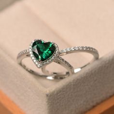 Luxury Heart Cut Emerald Ring For Formal Occasions, Luxury Heart Cut Emerald Ring For Anniversary, Emerald Heart-shaped Anniversary Rings, Emerald Heart Shaped Anniversary Rings, Fine Jewelry Green Heart Shaped Ring, Green Heart-shaped Fine Jewelry Ring, Heart Cut Emerald Ring For May Birthstone, Heart-shaped Emerald Rings For Wedding, Elegant Heart-shaped Emerald Ring For Anniversary