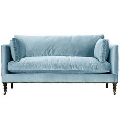 a light blue couch with two pillows on the back and one arm upholstered