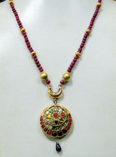 "Vintage 22 K solid gold genuine Uncut Diamond set pendant strung with Natural Ruby beads Necklace. Length-50 cm(19.69\")free size ,easy to adjust length by adjusting the toggle), size of pendant-7.5/3.5 cm, weight-38 grams.,Material-22 K gold, Uncut genuine Diamonds (polki), Ruby beads." Gold Necklace With Meenakari Round Pendant, Gold Meenakari Round Pendant Necklace, Gold Meenakari Necklace With Round Pendant, 22k Gold Necklace For Puja, 22k Gold Locket Necklace In Temple Jewelry Style, 22k Gold Locket Temple Necklace, Traditional 22k Gold Round Pendant Necklaces, Temple Necklace With Round Pendant For Festivals, Festive 22k Gold Locket Necklace