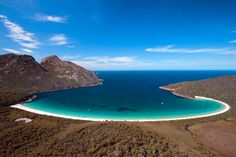 an aerial view of the white sand beach in australia