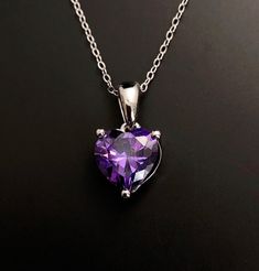 Solid Sterling Silver Amethyst February birthstone heart pendant. Great February birthday gift, valentines gift or 6th wedding Anniversary gift. Matching earrings available here: https://www.etsy.com/listing/1352794165/ Available to order in gold, white gold, rose gold or platinum, please contact me for prices. 💎Pendant thickness: 6mm 💎Pendant width: 9mm 💎Pendant overall Length: 17mm 💎Chain length: 18 inch or other length if required. ✨ For free giveaways, special offers and latest design up Purple Heart Necklace, February Birthstone Necklace, 6th Wedding Anniversary, 6th Anniversary Gifts, Free Giveaways, February Birthday Gifts, February Birthday, 6th Anniversary, Heart Gemstone