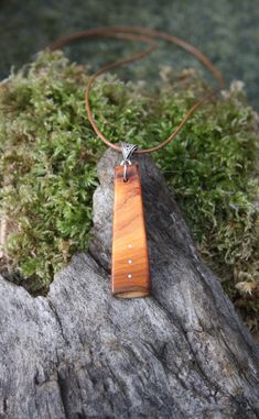 "A rare find, this beautiful and unique Irish yew wood necklace has been made for you, or a loved one, in my studio on the West of Ireland. This minimalist pendant features a piece of Yew wood, recycled from musical instruments constructed by a local luthier. As a musician myself, I take enormous satisfaction in creating a necklace whose inherent wood has previously featured in a beautiful hand-made harp or guitar. Considered one of the Sacred trees in the Celtic world, the Yew has long been ass Irish Yew, Yew Wood, Sacred Tree, Minimalist Pendant, 5th Anniversary, Wood Necklace, Wooden Pendant, Wood Gifts, Harp