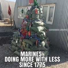 a large pile of bags sitting in front of a building with the caption marines doing more with less since 17 / 75