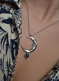 In the Ancient mythology Zirna was an Etruscan goddess of the waxing moon. The moon is the symbol of the soul, the closet celestial body of the planet Earth. This is a sculptural pendant, carved in wax, casted in Sterling silver, set with a beautiful Lapis Lazuli gemstone & polished to a beautiful burnished silver finish. It is harmonized with a high quality long silver cable chain. Circumference is 42 cm. Looks great layered on it's own but do not hesitate to pair it with other chain necklaces Sterling Silver Sun And Moon Spiritual Necklace, Sterling Silver Spiritual Necklace With Sun And Moon Design, Spiritual Sterling Silver Necklace With Sun And Moon Design, Spiritual Sterling Silver Sun And Moon Necklace, Bohemian Sterling Silver Moon Phase Necklace, Spiritual Silver Crescent Necklace, Bohemian Moon Phase Necklace In Sterling Silver, Sterling Silver Necklaces With Sun And Moon Design, Spiritual Sterling Silver Moon Phase Necklace