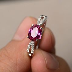 This is a gorgeous handmade creation. Its beauty is its simplicity & Elegance. The 6*8 mm oval shape faceted lab Ruby is crafted in solid sterling silver and with rhodium plated. Main stone weight about 1.75 ct. CZ as accents. All item is sent in a beautiful gift box If you have any idea of design your ring,pls contact me directly. You can realize more lovely stuff clicking the link https://www.etsy.com/shop/knightjewelry?refshopsection_shophome_leftnav Please leave the correct address and y Wedding Rings Oval Cut, Rings Ruby, Garnet Wedding Rings, Star Ruby Ring, Rings Oval, Ruby Wedding Rings, Swiss Blue Topaz Ring, January Birthstone Rings, Red Stone Ring