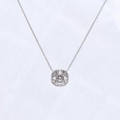 Metal: 925 Sterling Silver Stone: Round Cut (4.25mm and 2.8mm) Stone Carat Weight: 0.52 ct Overall Dimension: 11mm(D) Max Chain Length: 18 in Adjustable Lobster Claw Closure: 16 in, 17 in, 18 in Timeless Silver Round Diamond Necklace, Classic Silver Diamond Necklace With Halo Setting, Timeless Silver Round Cut Diamond Necklace, Timeless Silver Diamond Necklace With Round Cut, Timeless Round Solitaire Platinum Necklace, Sterling Silver Diamond Necklace With Halo Setting, Timeless Round Platinum Solitaire Necklace, Silver Round Cut Diamond Necklace Timeless Style, Classic Silver Solitaire Necklace With Single Cut Diamonds