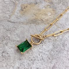 * DETAILS * * Gold Filled Necklace - Copper Based with 14K Gold Filled Chain - 14K Gold Filled Toggle Clasp 9mm - Gold Plated Emerald Crystal Glass Pendant 9mm*7mm - 14K Gold Filled Link Rings 👉🏻 You may also like the matching earrings in the photos. Here is the link. https://www.etsy.com/JinnysJewelryBySeJin/listing/955323557/emerald-huggie-earrings?utm_source=Copy&utm_medium=ListingManager&utm_campaign=Share&utm_term=so.lmsm&share_time=1612684001759 * WHAT IS GOLD FILLED * Go Stone Pendants Gold, Green Gemstone Pendant Necklace, Gold Emerald Gemstone Necklace Gift, Elegant Gold-plated Emerald Pendant Necklace, Elegant Emerald Pendant Gemstones, Green Gemstone Necklace With Rectangular Pendant, Emerald Pendant Necklace, Emerald Green Necklace, Emerald Necklace Pendant