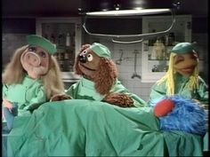 the muppets are in hospital bed with one person dressed as a dog and another is wearing a nurse's outfit