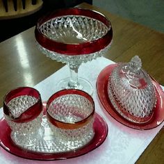 three pieces of glass sitting on top of a table