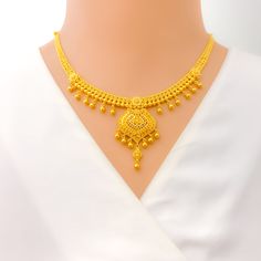 Weighing 34.1 grams of 22k yellow gold, this captivating tasseled heirloom necklace set exudes timeless elegance and luxury. The necklace, with a length of 16 inches and a 1.75-inch drop, showcases a beautiful tasseled design that adds movement and sophistication. The adjustable 1.75-inch links and hook lock provide flexibility and a secure fit. The set includes matching earrings, each measuring 1.75 inches, with secure screw-back posts for comfort and stability. Perfect for special occasions or Traditional Yellow Gold Necklace With Elegant Design, Festive Formal Necklace With Latkans, Elegant 22k Gold Necklace For Ceremonial Occasions, Yellow Gold Necklaces With Latkans For Festivals, Elegant 22k Gold Kundan Necklace With Latkans, Elegant Bridal Necklace With Latkans In Gold Plated, Elegant 22k Gold Ceremonial Necklace, Yellow Gold Plated Necklaces With Intricate Design, Elegant Yellow Gold Bridal Necklace With Latkans