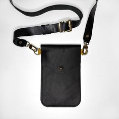 Our stylish slim phone bag is ideal to carry and protect your mobile and other accessories on a busy day or night out! It has two inner sections - big deep pockets enough for large mobile phones and another necessary things you carry with you such as key, a slim wallet or a card holder.  The bag has an adjustable strap and high quality golden accessories.  It goes with a stylish box, wrapping paper and a ribbon, which makes it a perfect gift for upcoming Christmas or for any other occasion. Dime Functional Rectangular Phone Bag For On-the-go, Rectangular Phone Bag With Card Slots For On-the-go, Trendy Mobile Phone Bag Pouch For Everyday Use, Trendy Mobile Phone Pouch For Everyday Use, Black Crossbody Mobile Phone Pouch, Modern Pouch Phone Bag For Daily Use, Black Phone Bag With Adjustable Strap For Everyday, Modern Rectangular Phone Bag For Everyday, Modern Mobile Phone Pouch For On-the-go