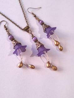 Purple Turquoise flower jewelry set purple flower set necklace earrings purple Turquoise flower bronze jewelry set purple Boho set gift for her Gorgeous  Victorian style jewelry set necklace and earrings . Bohemian necklace and earrings . Beautiful Set of bronze-tone filigree ornaments and rare purple Turquoise and purple plastic flowers necklace and earrings. Bronze Victorian style necklace and earrings. Boho necklace. Bohemian necklace and earrings. Romantic necklace and earrings. Royal style Handmade Purple Jewelry For Wedding, Dainty Purple Jewelry With Matching Earrings, Handmade Purple Jewelry Sets As Gift, Wedding Jewelry With Flower Charm In Brass, Adjustable Bronze Jewelry For Gifts, Wedding Brass Jewelry With Flower Charm, Bohemian Metal Jewelry With Flower Charm, Purple Metal Jewelry For Gift, Lavender Bohemian Dangle Jewelry