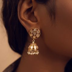 Adorn your ears with the grace of these mini pearl jhumkis. Round mother of pearls intricately arranged in captivating patterns are embraced by metal frames that elevate their elegance. The addition of delicate pearl hangings lends a touch of refinement to these jhumkis, creating a harmonious blend of sophistication and charm. Gifting: This choker set comes in a beautiful Yamoona gift box, making it an ideal gift for birthday, wedding anniversary or wedding gift. Occasion: Perfect choice for any Metal Frames, Mother Pearl, The Grace, Gold Plated Silver, Gold Material, Wedding Gift, Favorite Jewelry, Metal Frame, Semi Precious