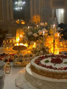 a table topped with a cake covered in frosting