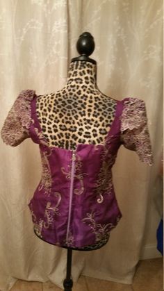 Lace blouse can be used on a skirt, pant ND African fabric. Elegant Fitted Purple Blouse, Fitted Evening Sets With Short Sleeves, Purple Silk Party Sets, Fitted Dress With Padded Blouse, Purple Silk Sets For Formal Occasions, Purple Silk Evening Blouse, Purple Silk Evening Top, Purple Long Sleeve Evening Blouse, Traditional Fitted Purple Dress