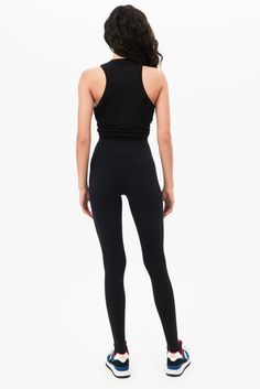 Our famous, form fitting high waist legging redesigned as a stirrup tight. Our ultra luxe Airweight fabric has a supremely soft hand and second skin comfort. BEST FOR: hot yoga, barre, Pilates. Model is 5'10" and wears a size small. Sleek Fitted Training Bottoms, Sleek Fitted Leggings For Pilates, Sleek Fitted Leggings For Workout, Sleek Fitted Workout Leggings, Sleek Fitted Sports Tights, High Rise High Stretch Functional Leggings, Full Length Athleisure Leggings With Minimal Stretch, Full Length Minimal Stretch Athleisure Leggings, Sleek Fitted Yoga Pants For Workout