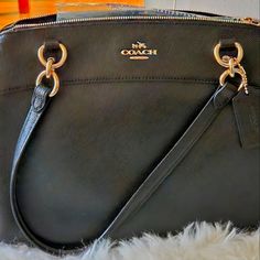 Never Used Elegant Coach Satchel For Travel, Chic Coach Satchel With Zipper Closure, Elegant Coach Satchel With Zipper Closure, Elegant Coach Satchel With Branded Hardware, Elegant Coach Shoulder Bag With Gold-tone Hardware, Chic Coach Shoulder Bag For Business, Elegant Black Satchel With Branded Hardware, Elegant Coach Satchel For Formal Occasions, Elegant Coach Bags