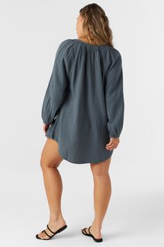 A flowy cover-up dress that has a relaxed long sleeve design and mini length fit. O'Neill Women's woven cover-up 28" In length Front button closure Solid color wash Lightweight, breathable fabrication 100% Cotton Crinkle Double Gauze Chic Long Sleeve Cover-up For Daywear, Relaxed Fit Long Sleeve Top For Beach Cover-up, Flowy Casual Tunic For Loungewear, Casual Flowy Tunic For Loungewear, Chic Long Sleeve Loungewear Cover-up, Casual Flowy Tunic Cover-up, Summer Long Sleeve Tunic For Brunch, Relaxed Fit Long Sleeve Cover-up For Vacation, Spring Casual Mini Length Cover-up