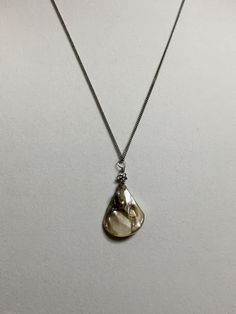 "Available in 16\", 18\" Sea shell pendant silver stainless stainless curb chain necklace, ornate with a 5mm silver plated alloy metal flower bead. Hand made jewelry! All purchase will arrive in gifts boxes. Thanks for stopping by!" Silver Shell Necklace With Pearl Pendant, Metal Shell Necklace As A Gift, Silver Shell Pendant Necklace For Gift, Metal Shell Necklace For Gift, Metal Shell Necklace Gift, Silver Pendant Shell Necklace Gift, Sterling Silver Shell Pendant Necklace As Gift, Silver Shell Necklace With Pearl Pendant As Gift, Adjustable Silver Drop Necklace With Pearl Pendant