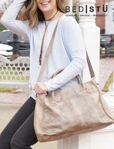 In this case, bigger is better. ROCKAWAY in black lux is big on looks, even better in function. Two strong handles support this voluptuous bag, detailed with crisscross tie details and a crackle effect finish. An optional shoulder strap can make this into a cross body as well, so carry confidently with ROCKAWAY. Chic Crossbody Travel Bag For Everyday Use, Chic Crossbody Travel Bag, Chic Everyday Crossbody Travel Bag, Chic Satchel Travel Bag With Adjustable Strap, Chic Travel Bag Satchel With Adjustable Strap, Chic Weekender Satchel Bag With Adjustable Strap, Chic Crossbody Travel Bag With Detachable Strap, Chic Satchel Weekender Bag With Adjustable Strap, Chic Travel Bag With Adjustable Strap And Double Handle