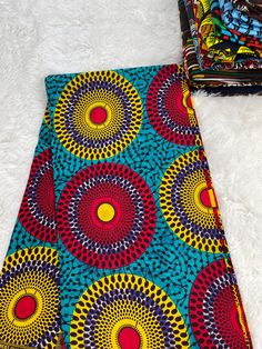 This Purple African Fabric is high quality African print made from 100% cotton and it's 45 inches wide. It is used for making African Clothing, African quilts, & For Home decoration. FYI: Print is Double sided. The listing is for 1, 6 yards and Headwrap Each piece of fabric measures:  36in by 45in for 1 yard 216in by 45in for 6 yards 70in by 22in for Head wrap If you purchase more than one yard, you will receive one continuous piece. *If you require more than what I have listed, feel free to send me email. CARE INSTRUCTIONS: *DO NOT BLEACH *Hand wash with cold water and mild soap or Dry clean *Press with hot iron for a crispy look. Color may be different due to your monitor Ankara Fabric With Vibrant Patterned Print, Vibrant Patterned Ankara Fabric, Cotton Batik Print Fabric, Multicolor Batik Print Cotton Fabric, Patterned Batik Print Cotton Fabric, Cotton Batik Print Multicolor Prints, Cotton Batik Print In Multicolor, Patterned Cotton Fabric With Batik Print, Cotton Fabric With Vibrant Patterned Print