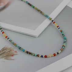 Transport yourself to an era of timeless elegance with our Vintage-Inspired Turquoise and Agate Necklace. This captivating piece seamlessly blends retro charm, Indigenous influences, and a touch of minimalist sophistication. Each turquoise bead, approximately 2.6mm in size, adds a burst of color to the necklace, complementing the natural beauty of agate. With a length of 36.5cm and an additional 7.5cm extension, the necklace is a versatile accessory crafted from turquoise, agate, crystals, and b Turquoise Crystal Necklaces With Natural Stones, Bohemian Amazonite Beaded Necklaces For Gifts, Bohemian Turquoise Necklace With Natural Stones, Bohemian Round Turquoise Necklace With Natural Stones, Bohemian Amazonite Beaded Necklace For Gift, Vintage Beaded Necklaces With Natural Turquoise Stones, Turquoise Crystal Necklaces With Gemstone Beads, Turquoise Necklaces With Natural Stones, Turquoise Gemstone Necklaces With Round Beads