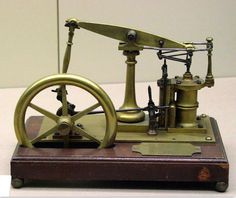 an old fashioned sewing machine sitting on top of a table