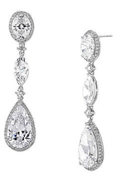 Accessorize in dazzling style with these hand-polished drop earrings set with sparkling crystals and plated in rhodium or 18-karat gold. 1 3/4" drop; 3/8" width 18k-gold plate or rhodium plate/cubic zirconia Imported Evening Cubic Zirconia Diamond Drop Earrings, Evening Drop Diamond Earrings With Cubic Zirconia, Silver Long Drop Chandelier Earrings With Sparkling Stones, Evening Teardrop Cubic Zirconia Diamond Earrings, Evening Teardrop Cubic Zirconia Earrings, Elegant Long Drop Chandelier Earrings With Sparkling Stones, Drop Chandelier Earrings With Sparkling Stones, Glamorous Cubic Zirconia Dangle Earrings, Long Drop Cubic Zirconia Chandelier Earrings For Formal Events