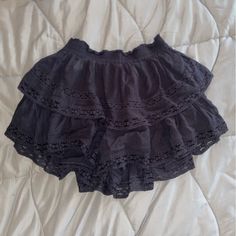 Black High-Waisted Tiered Skirt From American Eagle. Never Worn. Black Ruffled Bottoms For Vacation, Casual Black Flowy Shorts, Casual Black Tiered Skirt Shorts, Black Lined Skirt Shorts For Summer, Black Shorts With Lined Skirt For Summer, Chic Black Mini Skirt For Vacation, Vacation Black Mini Skirt, Chic Black Skirted Shorts, Black Mini Skirt With Elastic Waistband