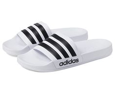 adidas Adilette Shower - Shoes : White/Black/White : Get yourself the trendy adidas Adilette Shower slippers. Synthetic upper, lining and insole. adidas logo on toe strap. Slip-on closure. Synthetic outsole. Imported. Measurements: Weight: 4 oz Product measurements were taken using size Men's 10, Women's 11, width Medium. Please note that measurements may vary by size. Adidas Sporty Slides For Training, Adidas Synthetic Slides For Swimming, Adidas Slides For Swimming In Summer, Adidas Slides For Summer Swimming, Adidas Sporty Synthetic Slides, Breathable White Slides For Beach, White Breathable Slides For Beach, Adidas Slides For Swimming, Adidas Cushioned Slides For Sports