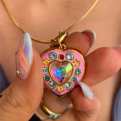 Gold Filled Enamel Heart Locket Necklace This adorable necklace features a gold filled enamel heart locket that will hold your most precious memories close to your heart. It is the perfect accessory for adding a touch of charm and personality to any outfit. Show your love in a cute and playful way with this locket necklace. Necklaces For Lexie, Cheap Multicolor Heart-shaped Jewelry, Affordable Playful Heart-shaped Necklace, Playful Cheap Heart-shaped Necklaces, Cheap Playful Heart-shaped Necklace, Luxury Heart Locket Necklace For Valentine's Day, Luxury Valentine's Day Charm Necklaces, Cheap Playful Pink Charm Necklaces, Luxury Collectible Heart-shaped Jewelry