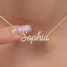 "This 14k personalized diamond name necklace is the perfect gift for the bridal party, someone special, or yourself.  How to order 1- Pick the fonts you like and send us a message 2- We will send you a picture of your name with the fonts you chose 3- If you like it any of them, place your order. 4- We send a final 3d mock up for approval. 5- Once approved we go ahead and finish your necklace. M A T E R I A L & L E N G T H Available in 14k Yellow Gold, 14k Rose Gold, 14k White Gold, Sterling Silver Stone: Natural Diamond Thickness: 1.2mm / 0.05\" Initials Lowercase: 4.5-5.5 mm Capital: 9-11 mm Diamond: 0.15 ct. - 0.60 ct. depending on the name Chain Length:  14+2, 16+2, 18+2 options or any length up to 20 inches without extension. (Please leave a note for the chain length) Color: G  Quality Personalized Name Necklace, Customizable Rose Gold Name Necklace For Wedding, Elegant Necklaces With Custom Text For Gift, Elegant Custom Text Necklaces For Gift, Elegant Diamond Nameplate Necklace Gift, White Gold Diamond Name Necklace Gift, White Gold Nameplate Necklace For Anniversary, Personalized Yellow Gold Name Necklace With Cubic Zirconia, Initials Name Necklace For Anniversary