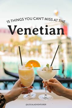 two people holding up drinks with the words, 15 things you can't miss at the venetian