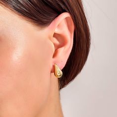 Add a touch of timeless elegance to your look with these Teardrop Earrings. These stunning earrings feature a classic teardrop design that enhances your natural beauty by offering a radiant shine that catches the light with every movement. Perfect for both casual and formal occasions, they are versatile enough to complement any outfit, from a simple day dress to an evening gown. - Made in 14k solid gold - Earring Width: 8.30 mm / 0.32 inches - Thickness: 9.05 mm / 0.35 inches - Length: 14.60 mm Modern Teardrop Clip-on Earrings For Formal Occasions, Timeless Teardrop Earrings With Polished Finish, Timeless Teardrop Polished Earrings, Teardrop Hoop Earrings With Polished Finish For Formal Occasions, Teardrop Hoop Earrings With Polished Finish For Formal Events, Modern Single Teardrop Clip-on Earring, Modern Teardrop Single Clip-on Earring, Modern Teardrop Jewelry With Elegant Design, Timeless Teardrop Hoop Earrings As Gift