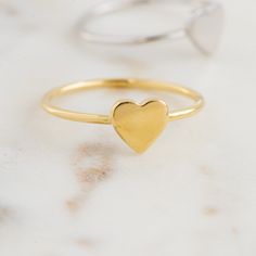 Beautiful, and dainty heart ring. ✿ Details ✿ ✤ Made of 925 Sterling Silver ✤ Available in 14k Gold or Rhodium Plated ✤ We use a THICK plating of 14k Gold for a piece that is sure to last years to come ✤ Nickel-free ✤ WILL NOT TURN FINGER GREEN! ✤ Available in Sizes 4, 5, 6, 7, 8, 9, or 10 ✤ Heart Measures 7 x 7 mm Stacking Rings Shown on Model: https://www.etsy.com/listing/739952471/dainty-diamond-stacking-eternity-ring?ref=shop_home_active_8&pro=1 https://www.etsy.com/listing/770233900/bra Heart Ring Gold, Layering Diamond Necklaces, Simple Diamond Ring, Opal Stacking Ring, Sterling Silver Opal Ring, Gold Heart Ring, Silver Opal Ring, Silver Heart Ring, Promise Ring Gift