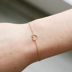 Nothing says 'I love you' like this gold and diamond heart bracelet. It's adjustable! Can be worn anywhere between 6" and 7", so one size fits most.