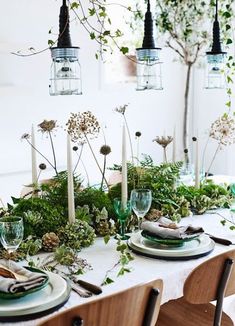 the table is set with candles and flowers