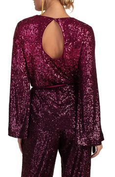 Take your look to glam new heights with this long-sleeve top covered in shimmery sequins. Back keyhole with button-and-loop closure Jewel neck Long sleeves 95% polyester, 5% spandex Dry clean Imported Glamorous Long Sleeve Tops With Contrast Sequin, Glamorous Long Sleeve Top For Holiday Party, Contrast Sequin Long Sleeve Tops For Night Out, Long Sleeve Sequin Tops For Holiday Party, Chic Long Sleeve Glitter Tops, Holiday Party Long Sleeve Sequin Top, Long Sleeve Tops With Contrast Sequin For Night Out, Glamorous Long Sleeve Glitter Tops, Glamorous Long Sleeve Festive Top