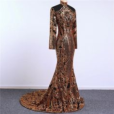 Stunning piece of embroidery, thousands of orangy gold sequins embroidered on black tulle to form this intricate design. This fabric is suitable for a stunning outfit to impress. Width is 140cm. Price is for one meter. Orders over one meter will be a continuous length of fabric. Black Fitted Sequin Fabric For Prom, Fitted Black Sequin Fabric For Prom, Fitted Black Glitter Evening Dress, Elegant Black Glitter Evening Dress, Glamorous Black Glitter Evening Dress, Gold Lace Evening Dress For Party, Black Fitted Sequin Dress For Wedding, Gold Glitter Evening Dress For Wedding, Gold Glitter Wedding Evening Dress