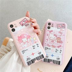 the hello kitty phone case is pink and has an id card attached to its back