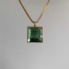 This handsome green tourmaline hangs on an 18k gold box chain for a classically cool feel. 18k yellow gold Tourmaline, 6.46 carats 12mm x 12mm (7/16" x 7/16") Chain is 18" long Tourmaline Pendant, Gold Box, Gift Card Shop, Green Tourmaline, Box Chain, Bracelet Gift, Ring Necklace, Jewelry Care, Tourmaline