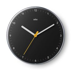 a black clock with yellow hands on a white background