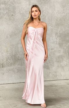 Light Pink Strapless Maxi Dress

How to style:
Take a formal () occasion to the next level in the luxe satin strapless maxi dress (). This thick baby pink material is stunning - you'll be radiating all night long. Pair with kitten heels and dainty jewellery () as the finishing touch.

Features:
  
 * Maxi length 
 * Strapless style  
 * Inner bust gripping 
 * Sweetheart neckline 
 * Fully lined 
 * Slight stretch 
 * Invisible left side zip closure 
 * Centre bust gathering 
 * Ribbon draping feature at centre bust  
Please note: Ribbon feature can either be left or tied in bow for a femme touch! Prom Dresses Light Pink, Light Pink Bridesmaids Dresses, Light Pink Formal Dress, Light Pink Midi Dress, Bridesmaids Pink, Light Pink Bridesmaid Dresses, 2024 Aesthetic, Dainty Jewellery, Prom Midi Dress