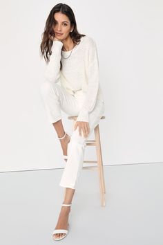 Grace everyone with your good energy in the Lulus Positive Presence Ivory Loose Knit Sweater! Medium-gauge loose knit shapes this must-have pullover sweater that has a rounded neckline, long sleeves with drop shoulders, and a relaxed-fit bodice. Notched hem creates a high-low effect for a stylish finishing touch! Fit: This garment fits true to size. Length: Size medium measures 23.5" from shoulder to hem. Bust: Great for any cup size. Waist: Not Fitted - comfortable room throughout midsection. U Off-white Long-sleeve Pointelle Knit Sweater, Off White Long Sleeve Pointelle Knit Sweater, Chic Oversized Pointelle Knit Top, Oversized Pointelle Knit Chic Top, Chic Winter White Soft Knit Sweater, Chic Oversized Pointelle Knit Sweater, Chic Neutral Knit Sweater, Versatile White Long Sleeve Knit Top, White Long Sleeve Versatile Knit Top