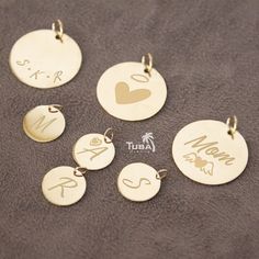 Here is a Personalized Gift for Mother's Day  Are you looking for a both "Affordable and Quality" gift gold jewelries for your loved one? You may be too close. 💝 A Precious Gift... For a Precious Heart... 🎁 👑 MATERIAL * Disc Pendant: 14K Solid Gold. (NOT Filled or Plated.) * Chain: 14K Solid Gold. (NOT Filled or Plated.) * Handmade Jewelry 🥇STAMPED FOR AUTHENTICITY * This gold jewelry is stamped to show it is 14 carat. ⚖️ PENDANT DIMENSIONS ⚖️ * Disk Diameter: 10mm, 15mm, 20mm  * The Average Thickness of the pendant: about 0.35mm - 0.40mm * Only Disk Pendant = 10mm, 15mm, 20mm : 0.45-1.60 grams * Disk Necklace = 10mm, 16" to 22" : 1.30-1.65 grams * Disk Necklace = 15mm, 16" to 22" : 1.70-2.05 grams * Disk Necklace = 20mm, 16" to 22" : 2.65-3.80 grams ⚖️ CHAIN NECKLACE DIMENSIONS ⚖️ * C Customized 14k Gold Jewelry, Customized Yellow Gold Jewelry Gift For Mom, Customized Minimalist Yellow Gold Jewelry, Customizable Yellow Gold Jewelry For Mom, Yellow Gold Initials Jewelry For Mom, Gold Disk Necklace, Disk Necklace, Gold Disc Necklace, Precious Gift