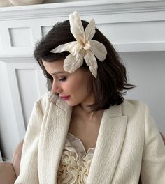 Comprised of Cream Silk Charmeuse our Silk Orchid Barrette is entirely handmade in NYC. Everlasting and robust this gorgeous barrette is a must have, a statement floral of everones' favorite transporting us to an ethereal place of eternal spring. Each petal is painstakingly pressed and detailed to create its lifelike allure. Made in NYC. Elegant Flower Hair Accessories With Handmade Flowers, Elegant Flower-shaped Hair Accessories With Handmade Flowers, Elegant Handmade Flower Hair Accessories, Elegant Hair Accessories For Spring Ceremonies, Elegant Spring Ceremony Hair Accessories, Elegant Handmade Flowers Headband, Elegant Cream Headpiece For Gift, Handmade Flowers Fascinator For Formal Occasions, Elegant Handmade Flower Hair Accessories For Formal Events