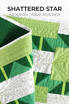 a green and white quilt with the text, shattered star modern table runner on it