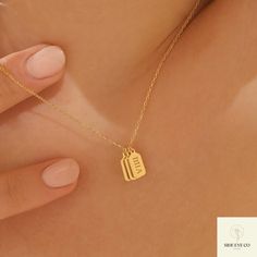 This 14k Solid Gold Personalized Bar Tag Necklace is the perfect anniversary gift for your wife. With its minimalist design, this elegant piece features vertical bars that can be engraved with initials, names, or significant dates, making it a deeply personal and meaningful keepsake. Crafted from high-quality 14k solid gold, the necklace combines timeless elegance with modern simplicity. Whether celebrating a special occasion or adding a personalized touch to everyday wear, this engraved name/da Minimalist Engraved 14k Gold Filled Jewelry, Minimalist Jewelry With Initials For Anniversary, 14k Gold Charm Necklace For Anniversary, Minimalist 14k Gold Filled Charm Necklace For Anniversary, Modern Nameplate Jewelry Gift, Simple Charm Necklaces With Delicate Chain For Anniversary, Dainty 14k Gold Charm Necklaces For Anniversary, Simple Charm Necklace With Delicate Chain For Anniversary, Dainty 14k Gold Charm Necklace For Anniversary