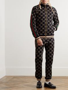 Part of the 'Love Parade' collection, Gucci's track jacket riffs on retro sportswear styles. It's made from smooth cotton-jersey that's printed with the brand's 'GG' monogram and trimmed with signature webbing along the sleeves. Wear it with the matching sweatpants. Gucci Sportswear, Gucci Clothes For Men, Gucci Tracksuit For Men, Gucci Jacket Mens, Adidas Originals Outfit, Gucci 2024, Gucci Tracksuit, Gucci Menswear, Gucci Clothes